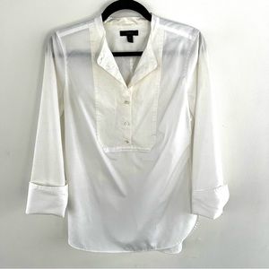 Collarless white top with yolk